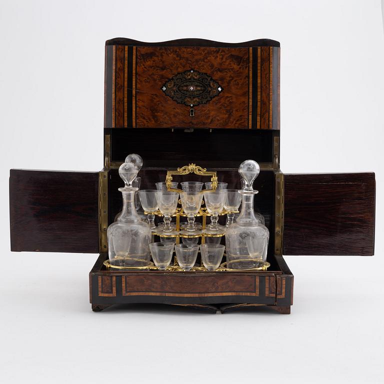 A French burr-walnut veneered tantalus, late 19th Century.