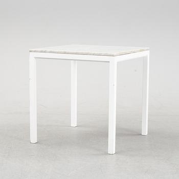 A marble top table, 21th century.