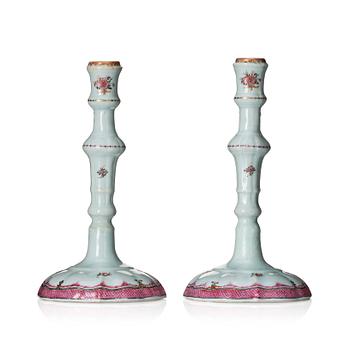 1080. A pair of famille rose candle sticks, Qing dynasty, Qianlong (1736-95).