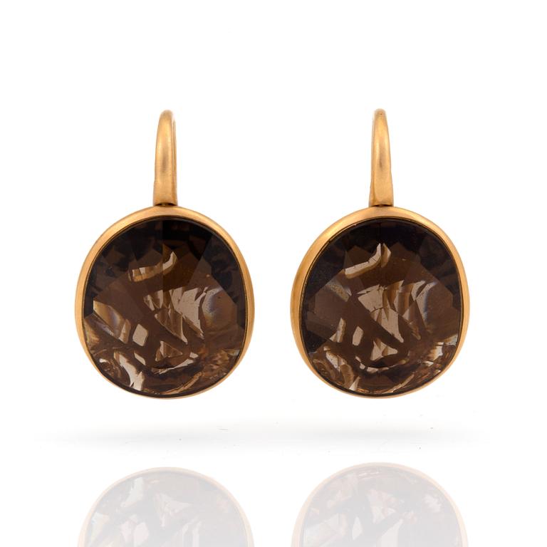 A pair of 'Arabesque', earrings by Pomellato set with mixed-cut smokey quartz.