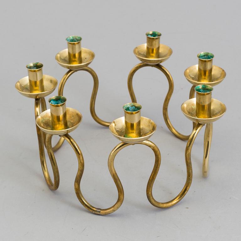 A Lars Holmström brass candle holder for seven candles, Svenskt Tenn, second half of the 20th century.