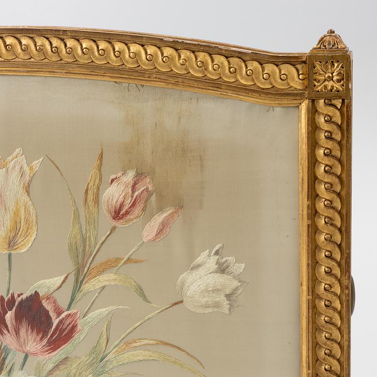 A Louix XVI-style fire guard, late 19th century.