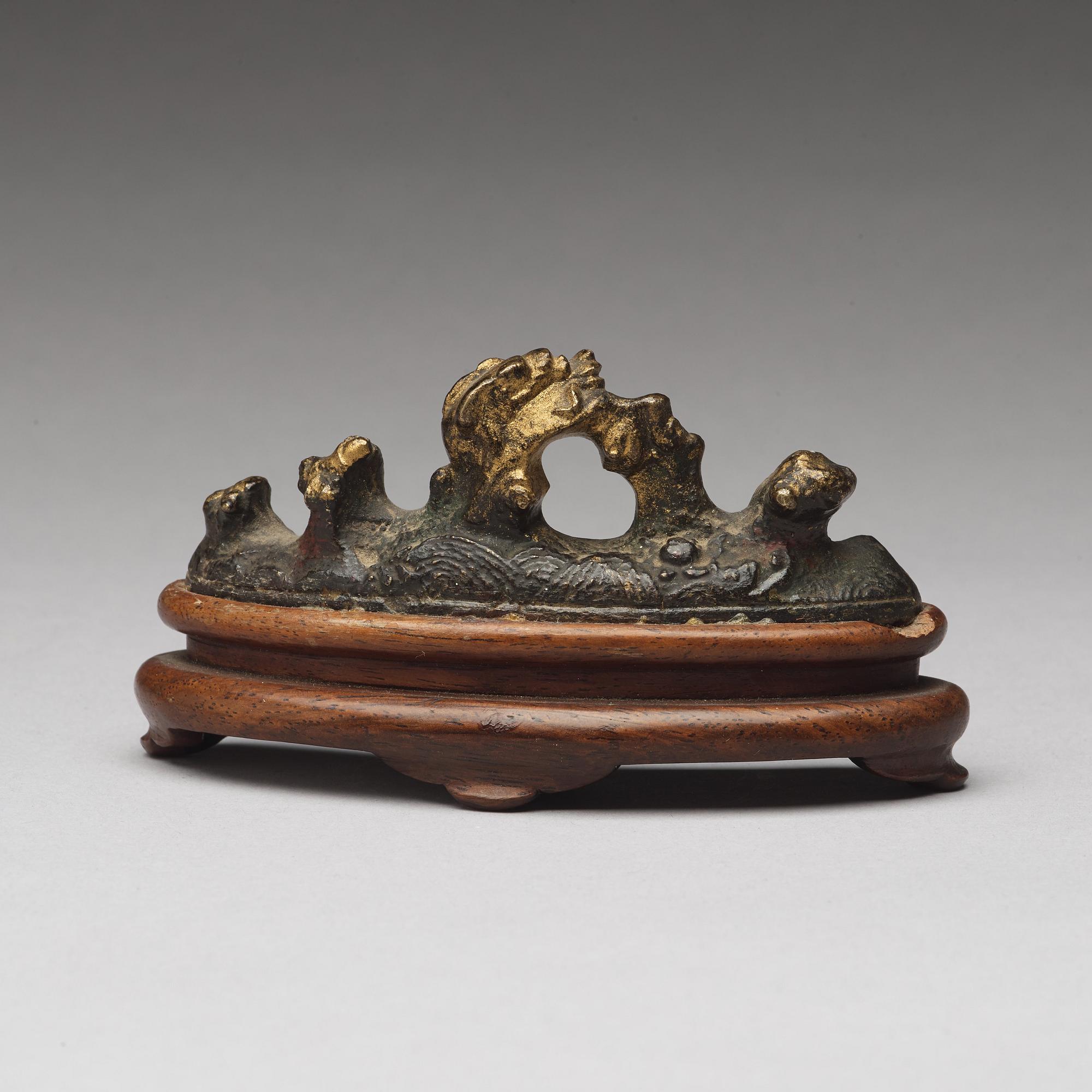 A bronze brush rest, Ming dynasty (1368-1644).
