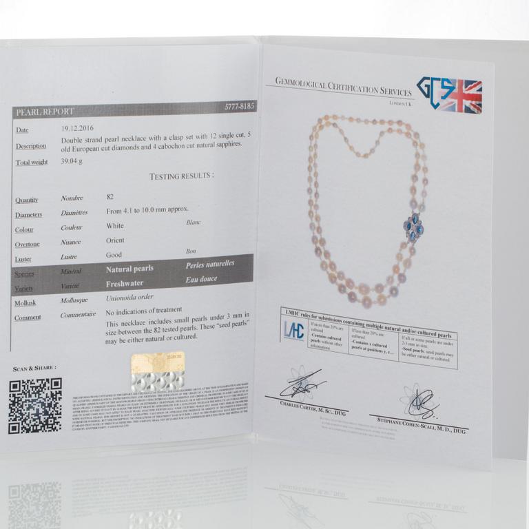 A two strand natural pearl-necklace Ø 4.10-10 mm with smaller pearls between.