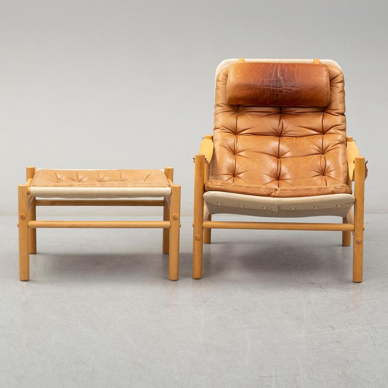 BROR BOIJE, a 'Junker' leather covered easy chair and ottoman from Dux.