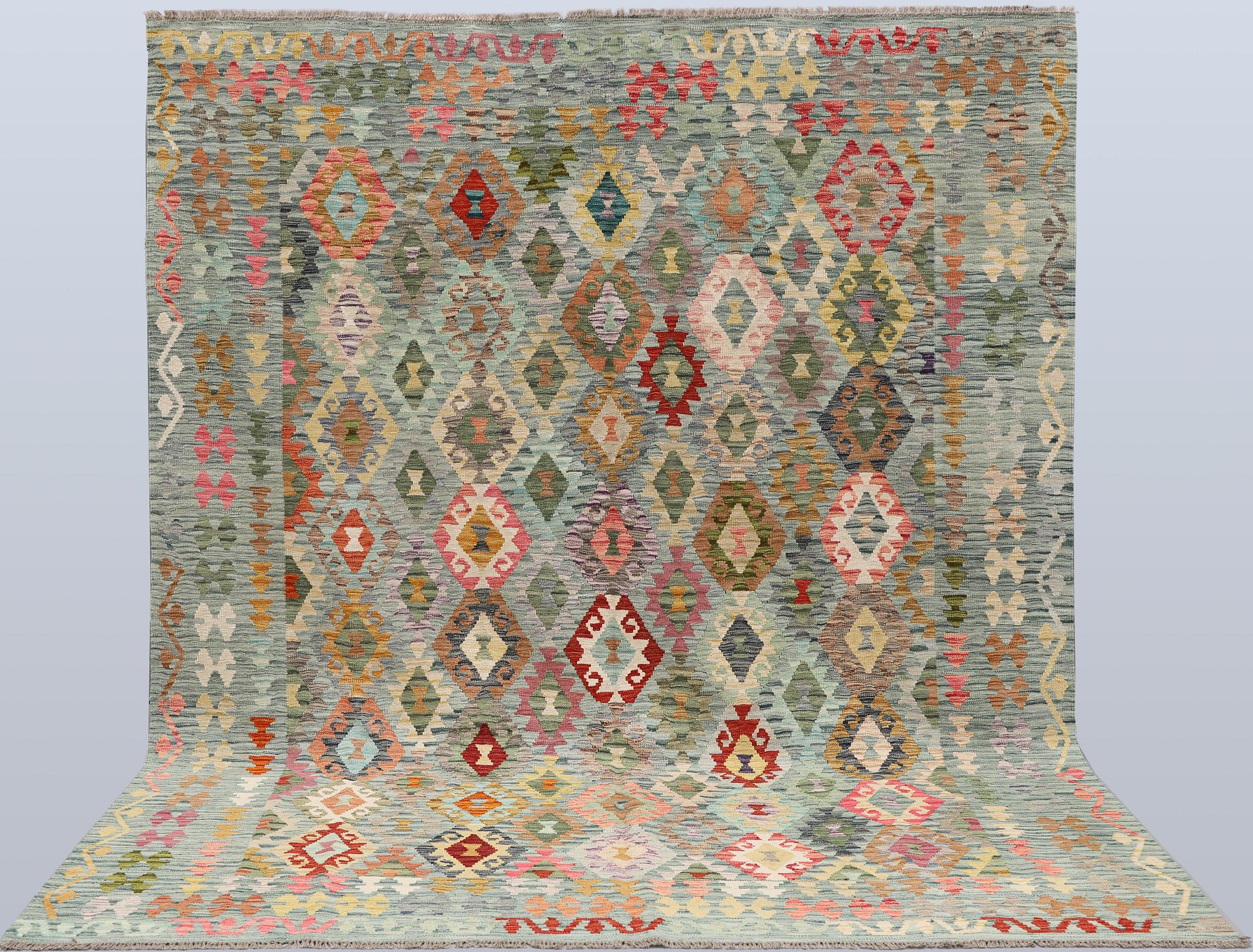A Kilim rug, approx. 298 x 248 cm.