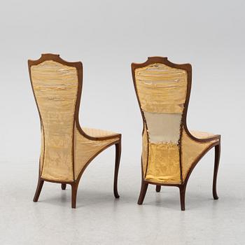 A pair of mahogany art nouveau chairs by Edward Colonna for Samuel Bing, Paris, early 20th Century.