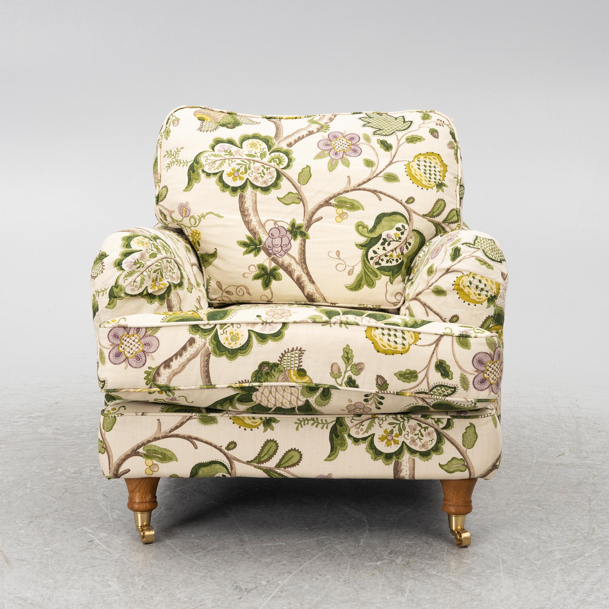 A 'Howard' armchair with footstool, Englesson.