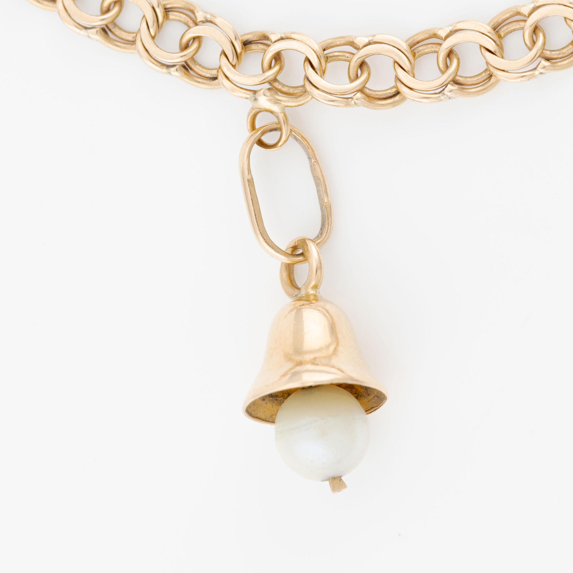 Armband, 18K guld med berlocker.