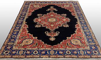 A carpet Tabriz around 265 x 170 cm.