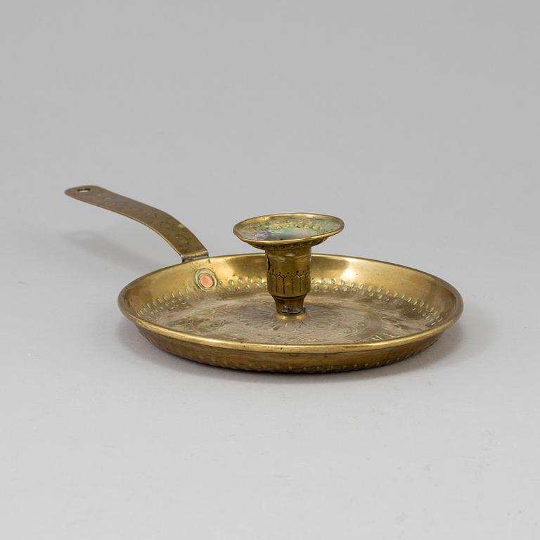 A brass candlestick, 19th century.