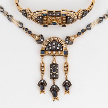 An 18K gold and silver necklace and a bracelet set with diamonds and sapphires.