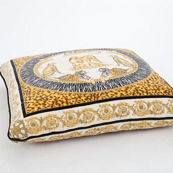 VERSACE, a velvet pillow.