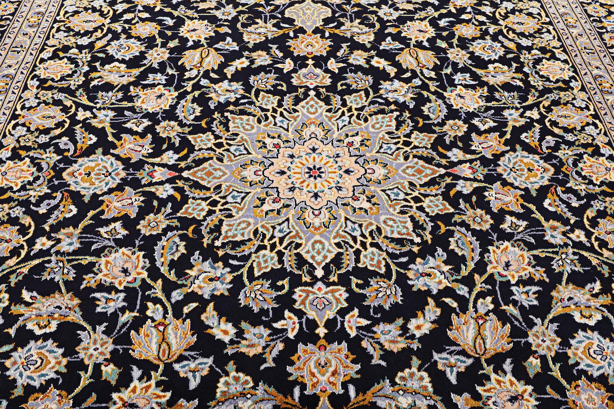 A Kashan carpet, signed, c. 410 x 270 cm.