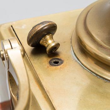 A brass samovar in a stand with a Kuznetsov porcelain teapot and bowl, latter half of the 19th century and early 1900s.