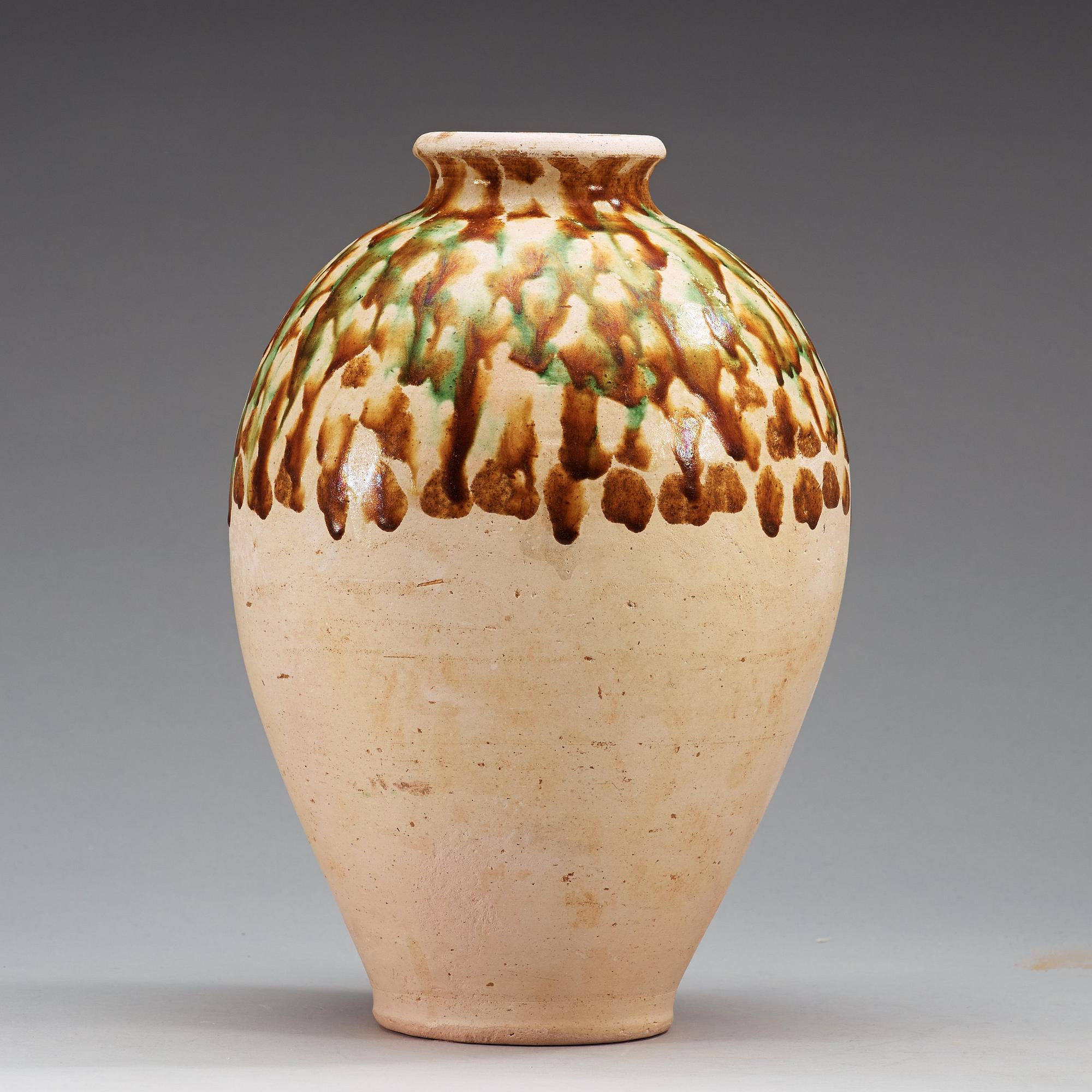 A Sancai-glazed pottery jar, Tang Dynasty (618-907).