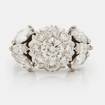 1026. An 18K white gold ring set with round brilliant- and navette-cut diamonds.