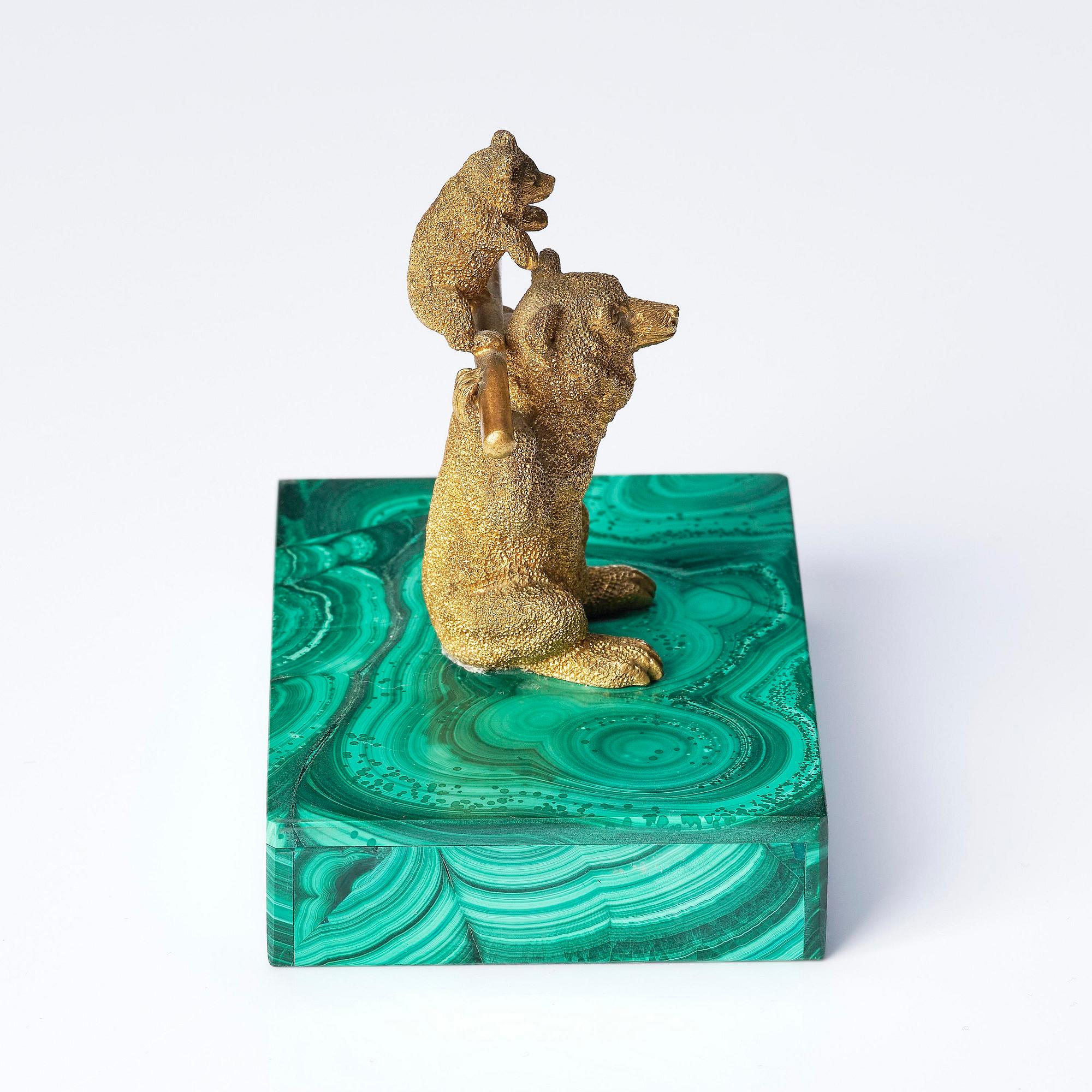 A Russian Nicholas II malachite-veneered and gilt-bronze paperweight, late 19th century.