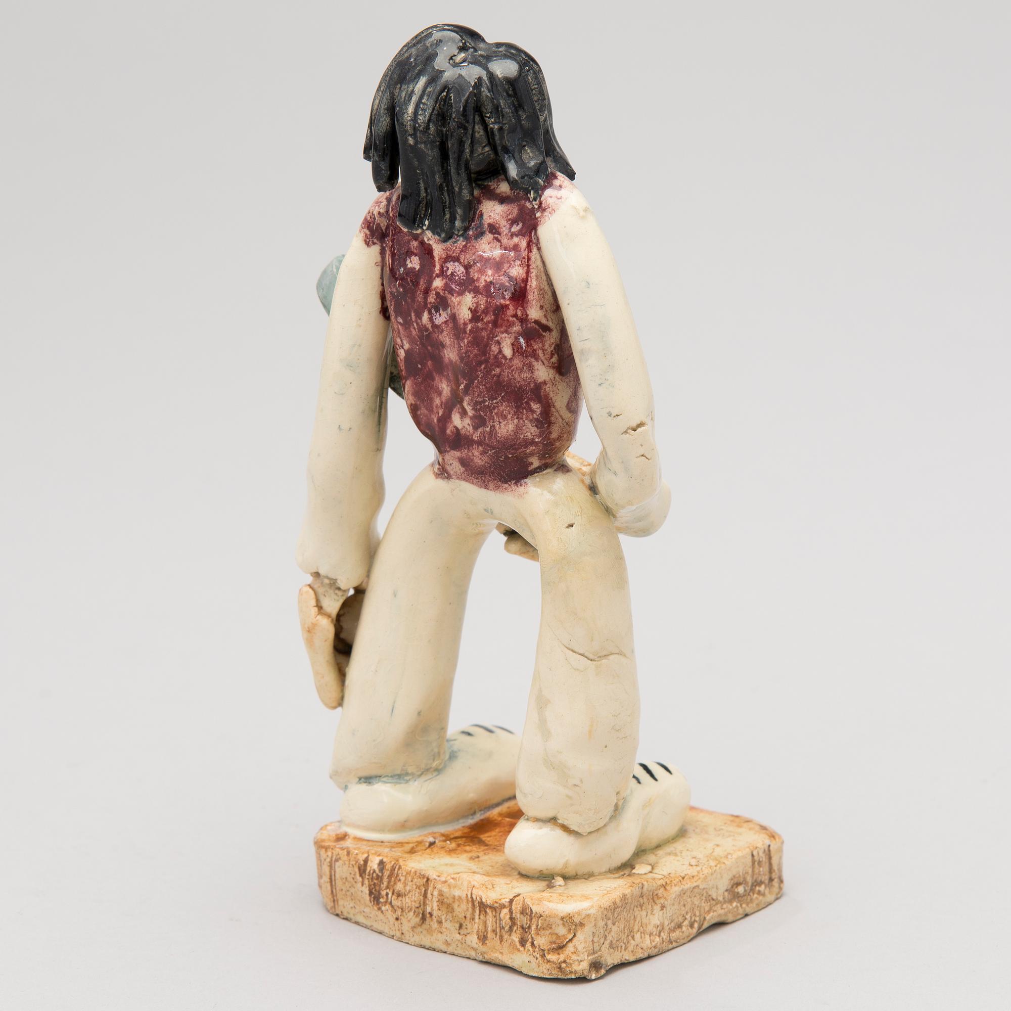 A 1930s ceramic sculpture signed Aja Arabia, Made in Finland.