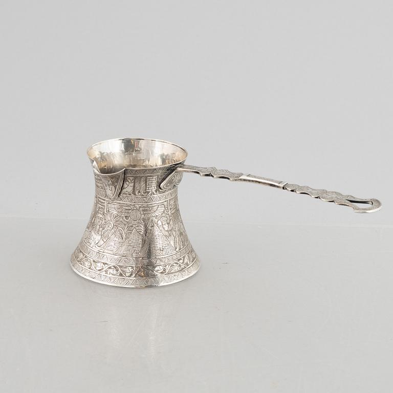 A silver 800 tray and coffee pot, and six glasses without marks. Probably Egypt.