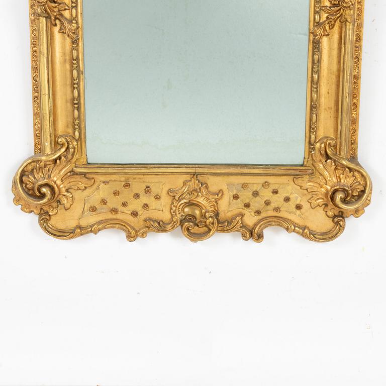 A Rococo style mirror, second half of the 19th Century.