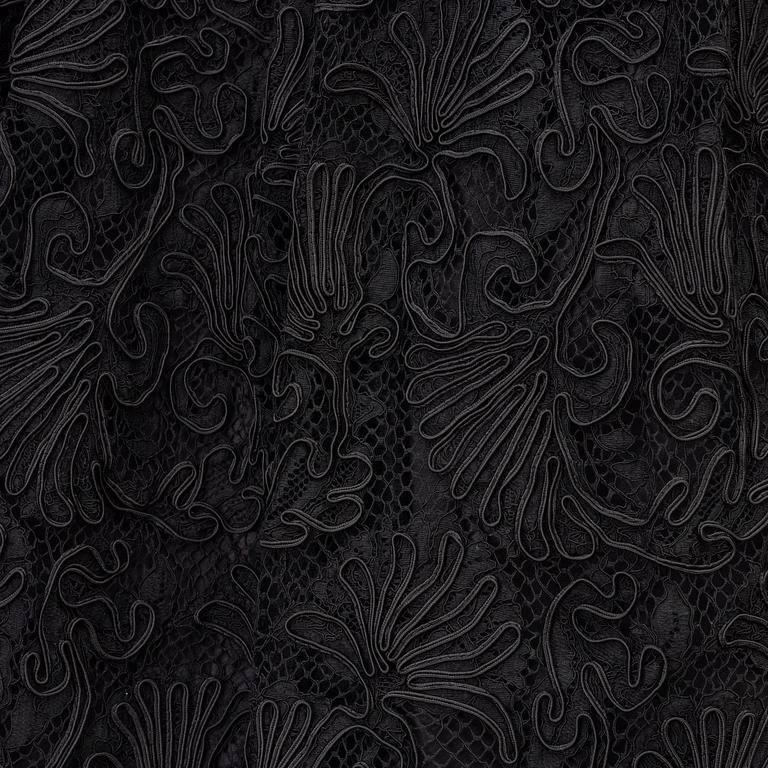 Prada, a black lace dress, size 38.