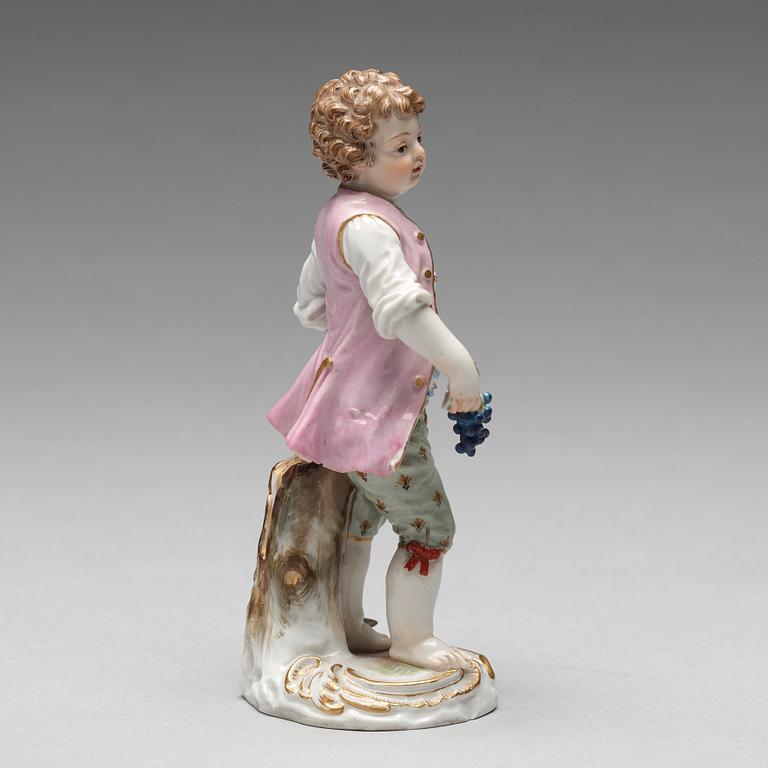 A Meissen figure of a young boy with grapes, 1890's.