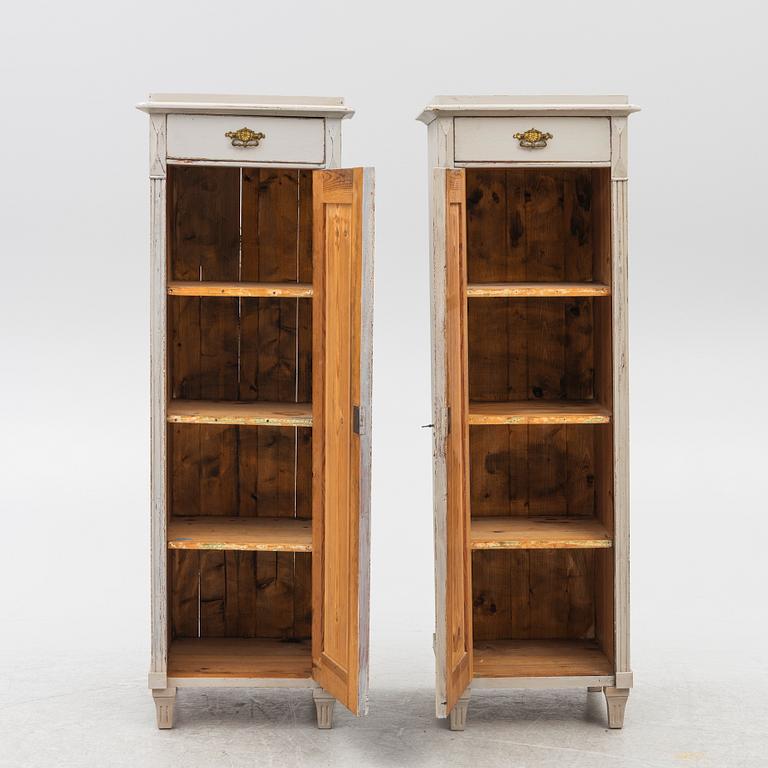 A pair of column cabinets, circa 1900.
