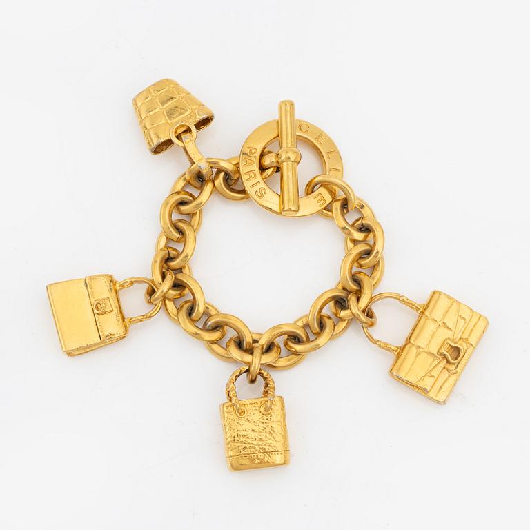 Céline, a gold tone charm bracelet.