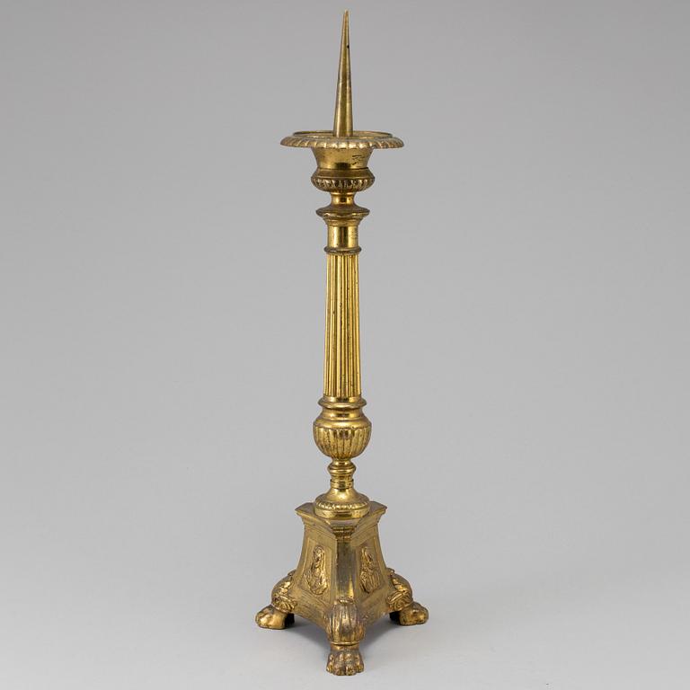 A 18th century bronze candlestick.