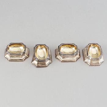 Four English early 18th century parcel-gilt silver salt-cellars, mark of Edward Wood, London 1727.