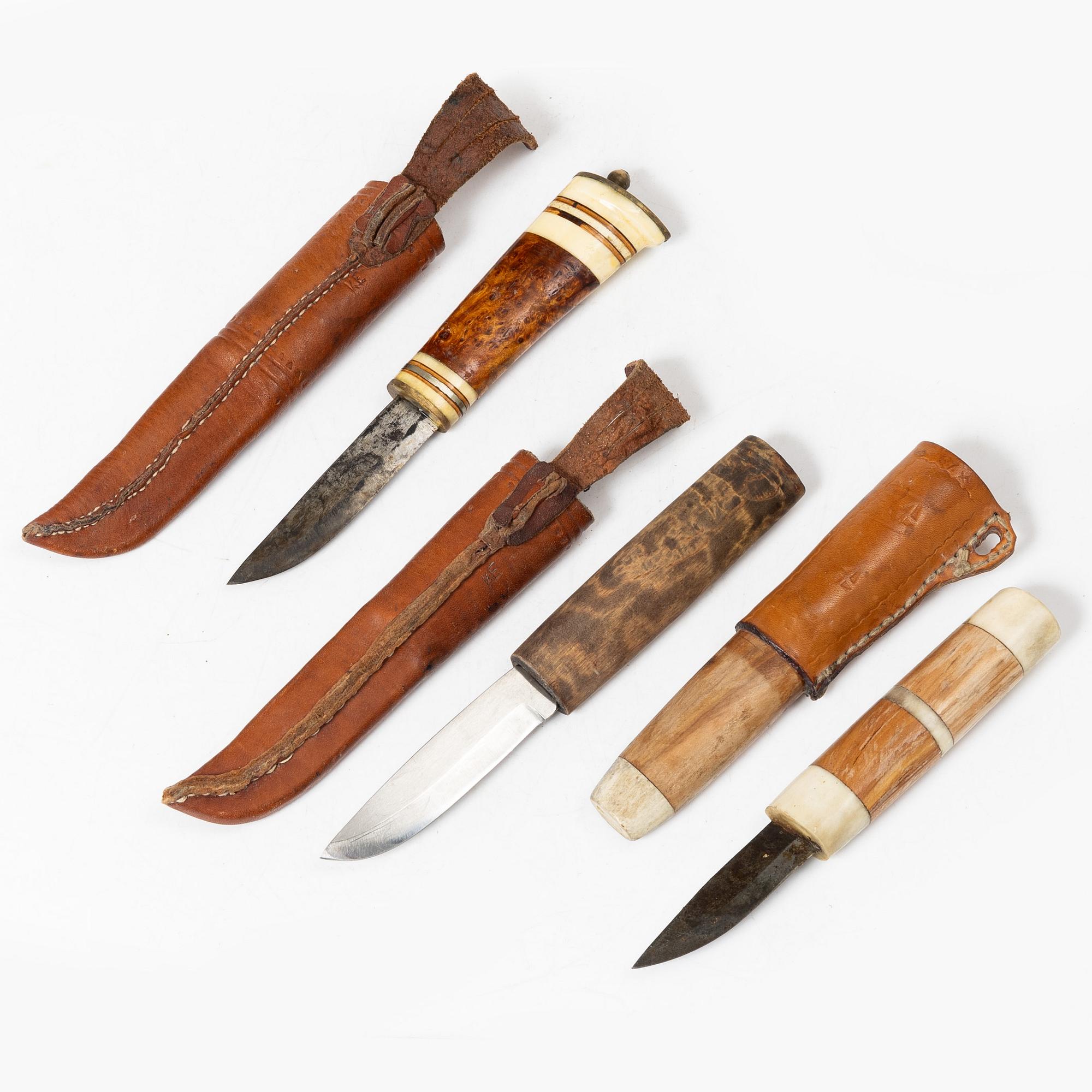 Six knives, and a cup.