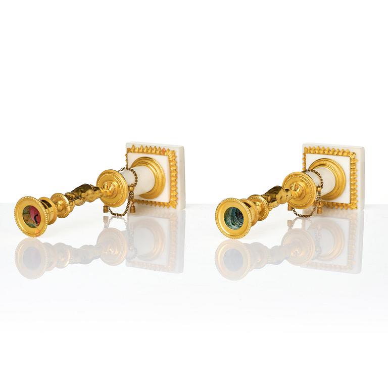 A pair of late Gustavian ormolu and white marble candlesticks, Stockholm, late 18th century.