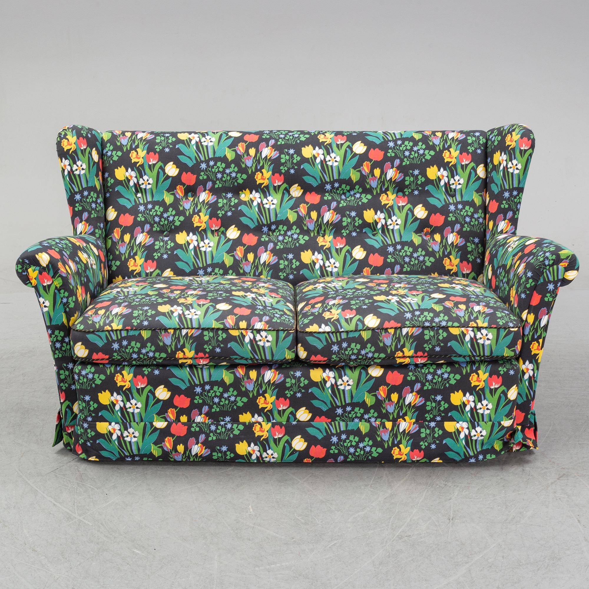 A sofa and wingback chair, later part of the 20th Century.
