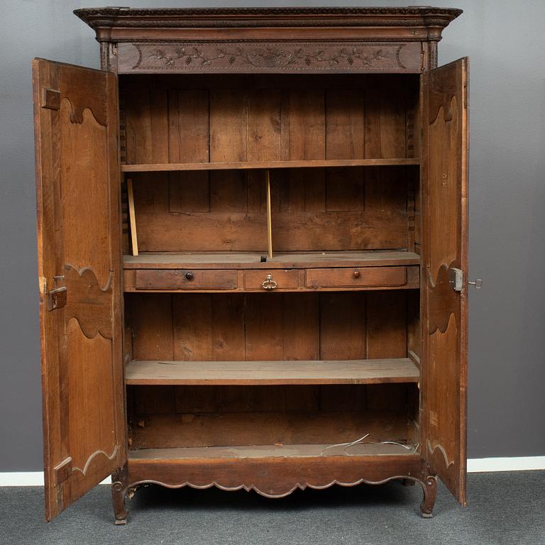 A french carved wooden cabinet, around 1900.