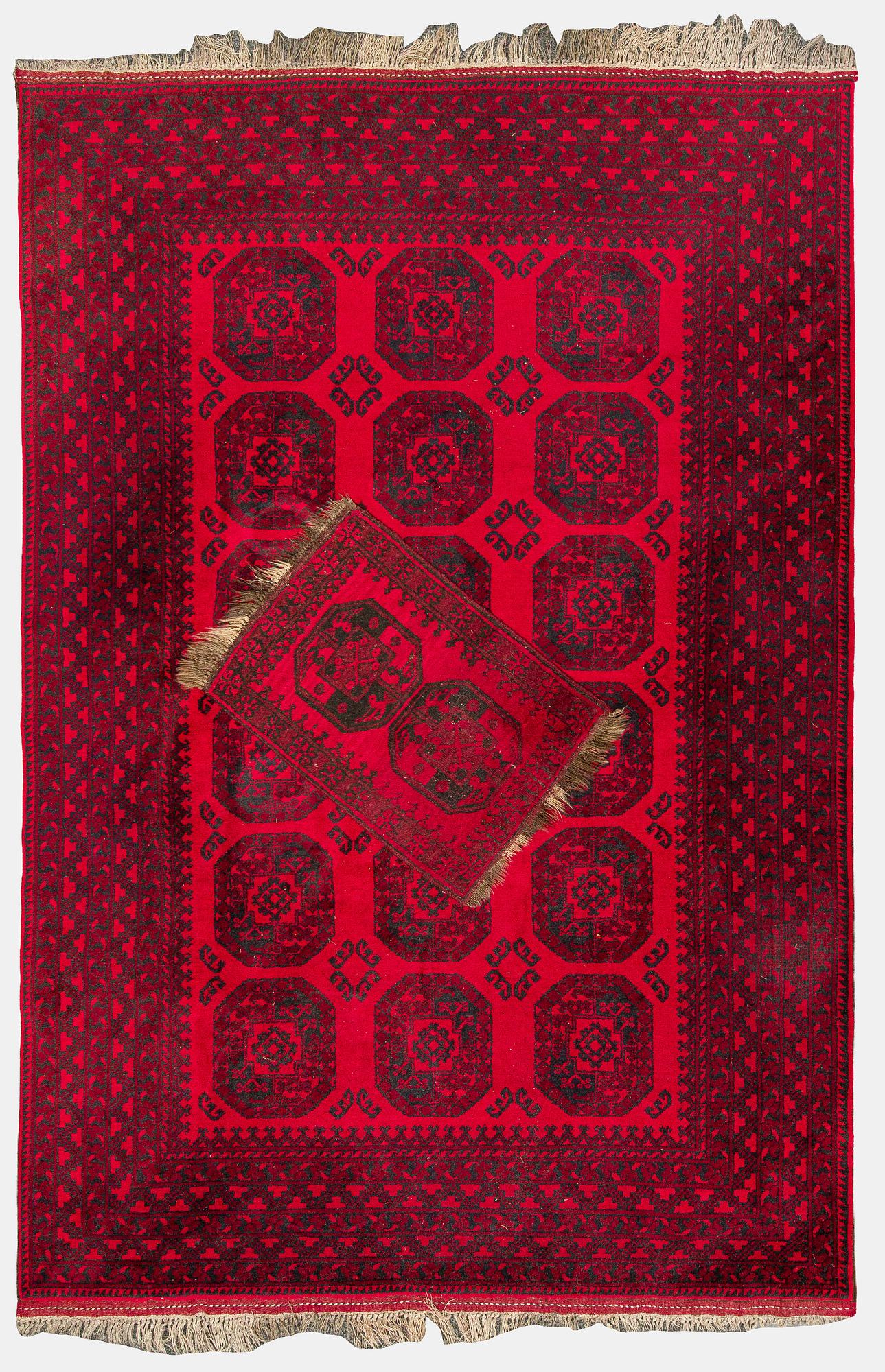 Two Afghan carpets. Ca. 326 x 217 and 88 x 63 cm.