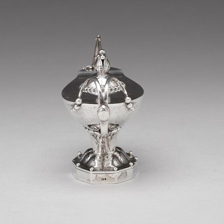 Georg Jensen, a cigar lighter in the shape of an oil lamp, Copenhagen 1918, design no 12, 830/1000.