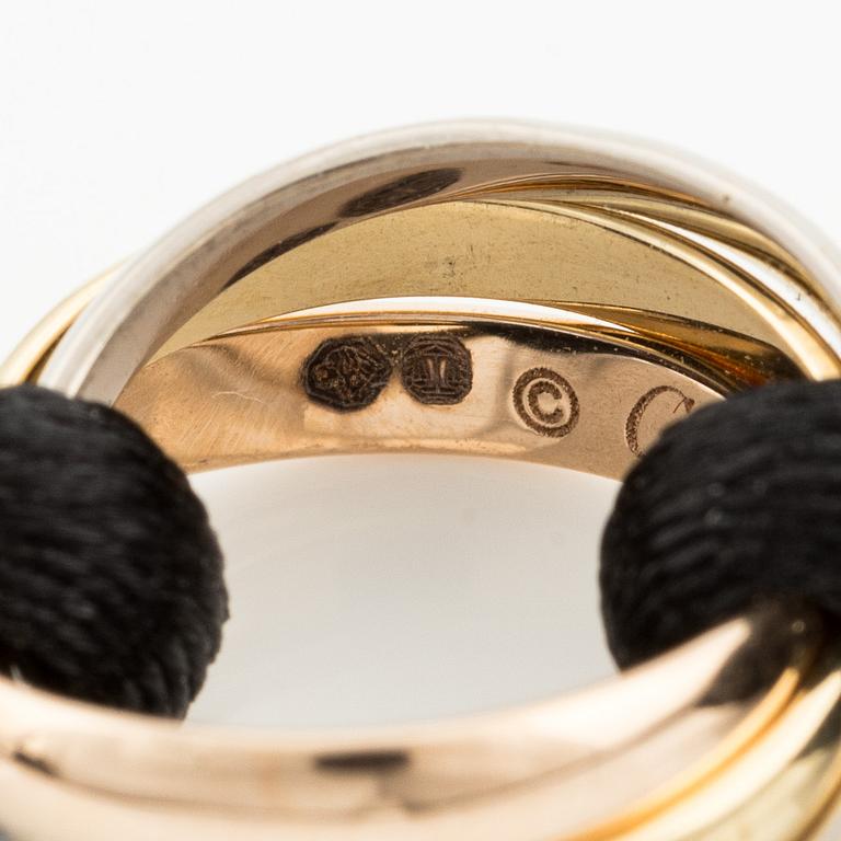 A Cartier "Trinity" bracelet, 18K three colour gold and textile.