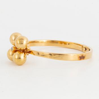 ARMRING, 18K guld med briljantslipad diamant, Design Relo Luzern.