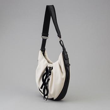 A vwite and black monogram hobobag by Yves Saint Laurent.