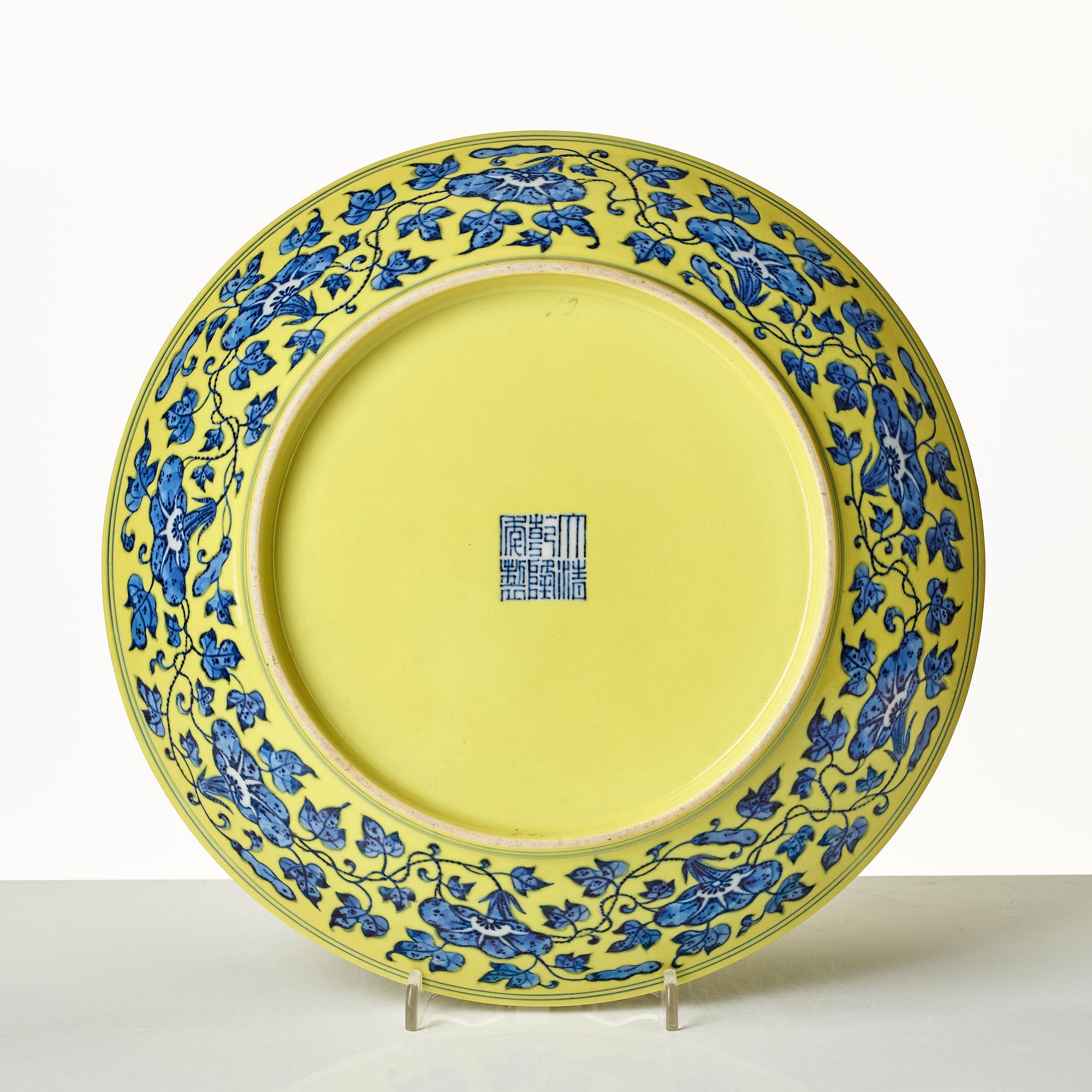 A large yellow ground underglaze blue peach dish, Qing dynasty, Qianlong six character mark (1736-1795).