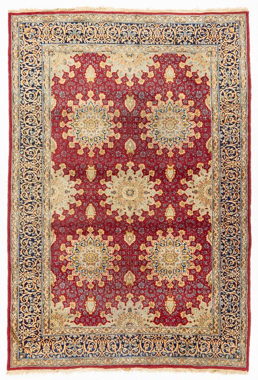 An oriental carpet, c. 290 x 198 cm.