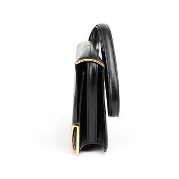 A 1970s black shoulder bag by Hermès.