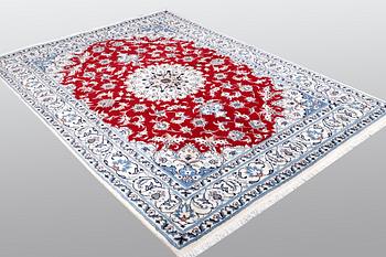 A carpet, Nain, part silk, ca 238 x 170 cm.