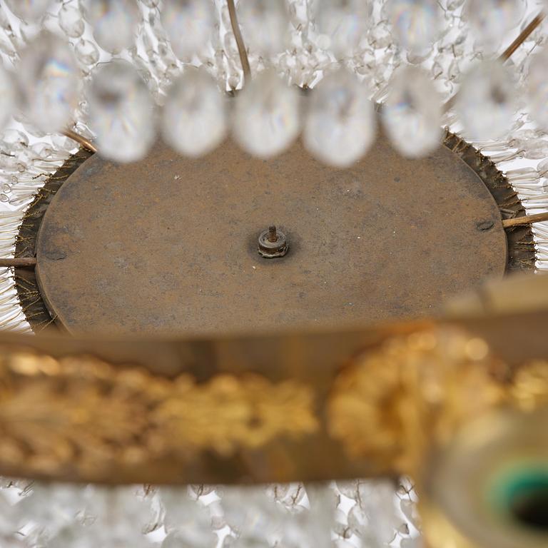 An ormolu and cut glass sixteen-branch Empire chandelier, Paris, early 19th century.