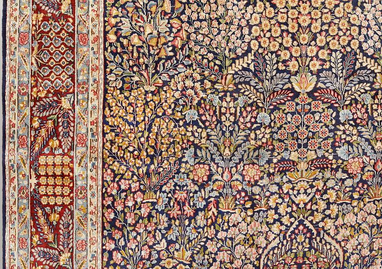 A 'Millefleur' Kerman carpet, c. 393 x 266 cm.