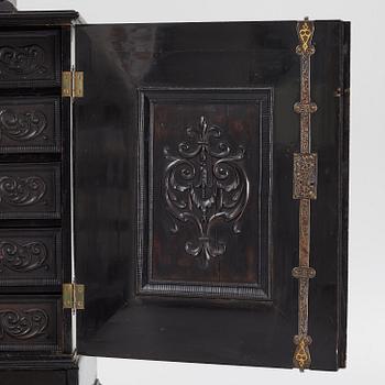 A South-German Baroque ebonized collector's cabinet on stand, circa 1700.