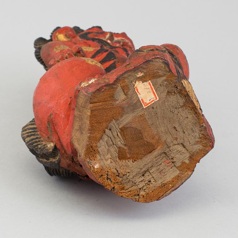 A wooden sculpture of a deity, India, circa 1900.