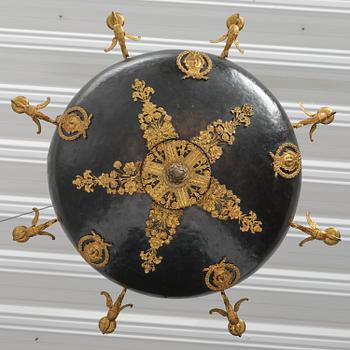 A presumably Russian Empire gilt and patinated bronze nine-branch chandelier, 19th century.