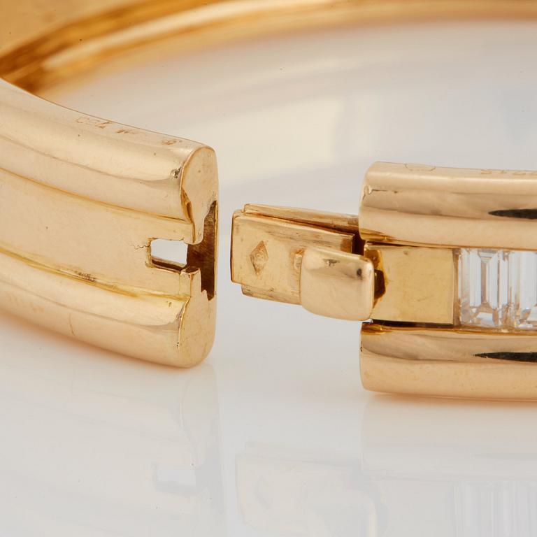 An 18K gold bracelet set with baguette-cut diamonds 7.715 cts according to engraving.